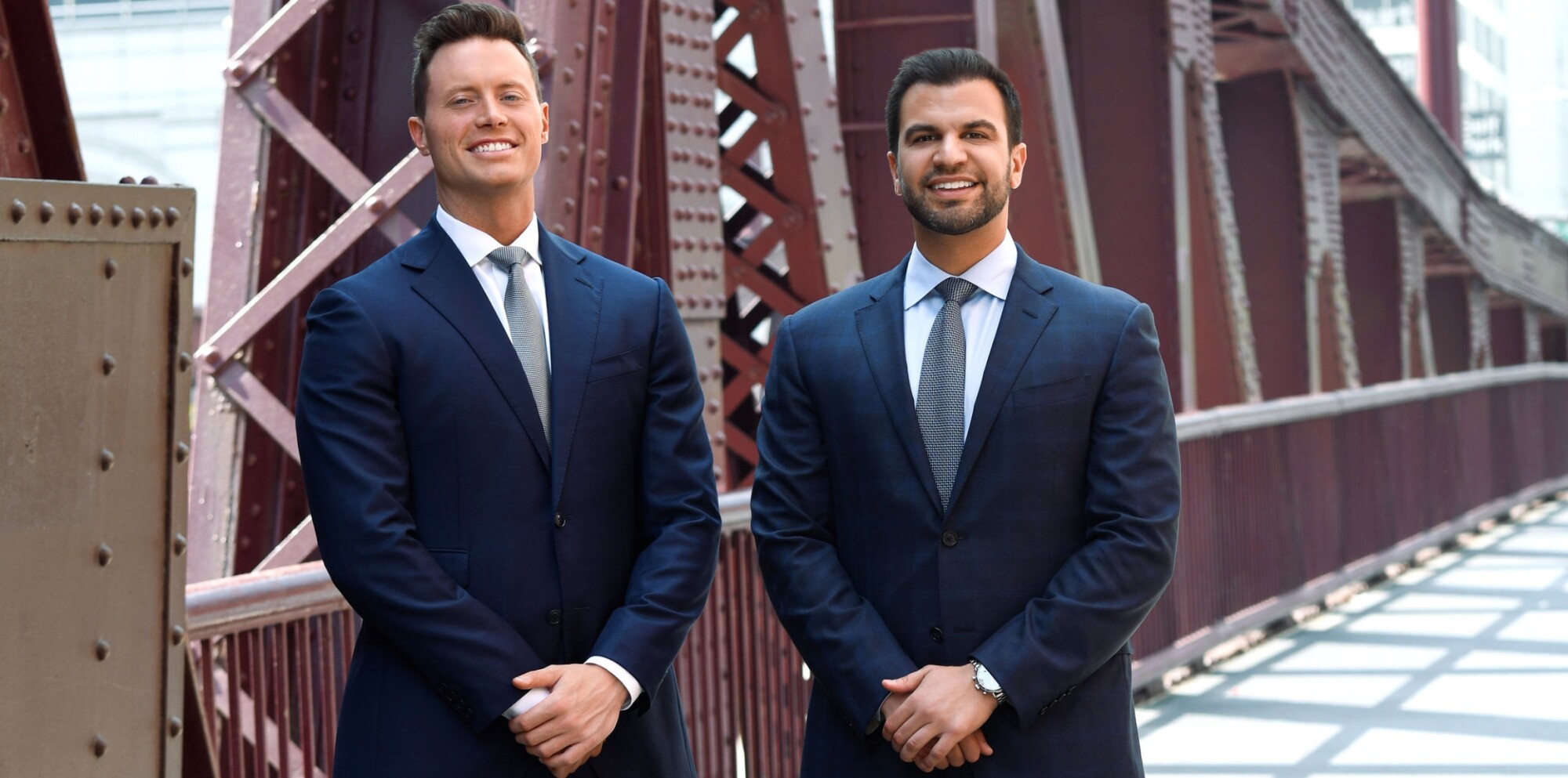 Picture of Partner Bryce T. Hensley and Partner Michael R. Grieco on the Clark St. bridge near the Romanucci & Blandin offices.